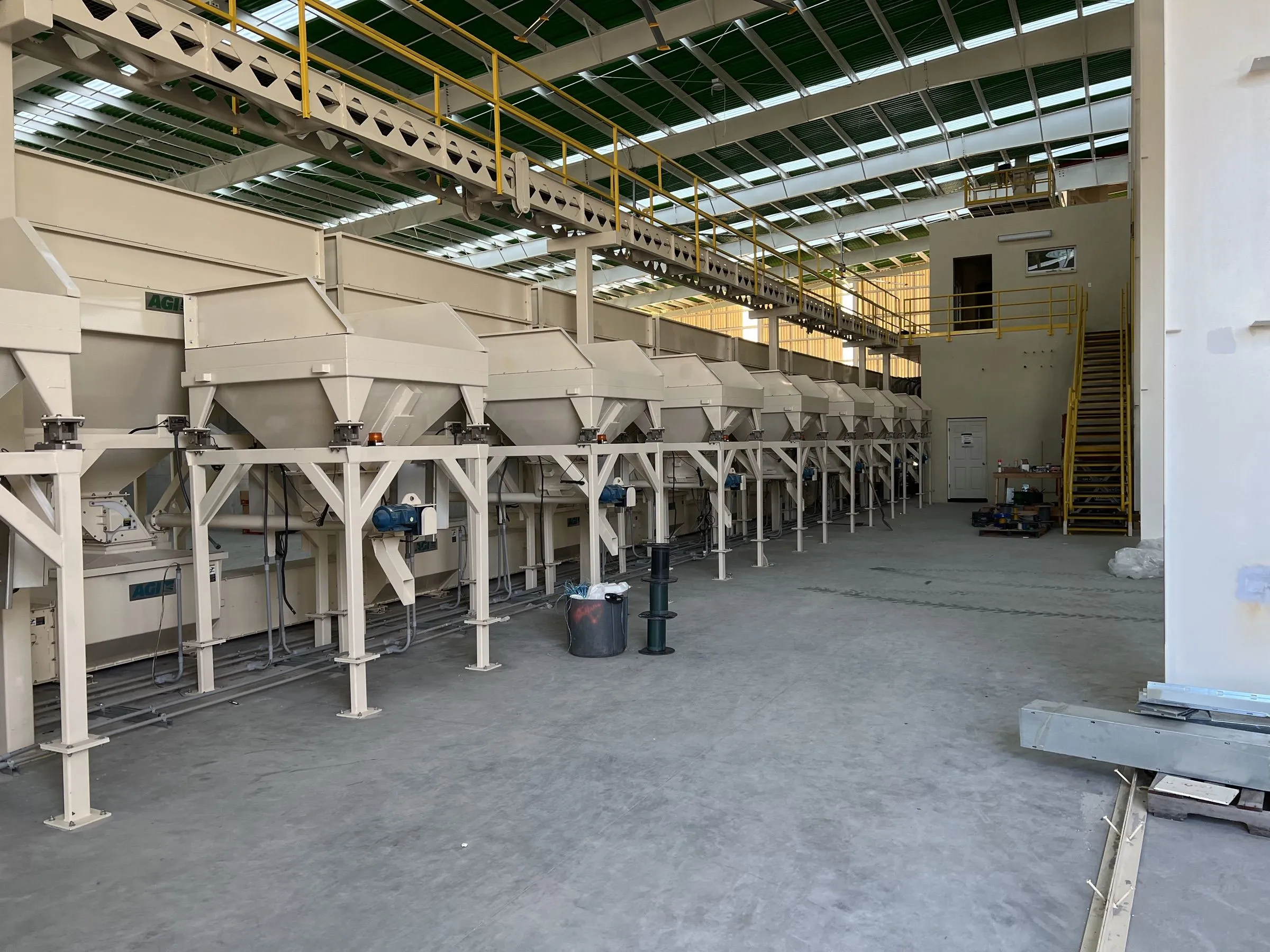 A row of hoppers inside the Moore Haven bag plant